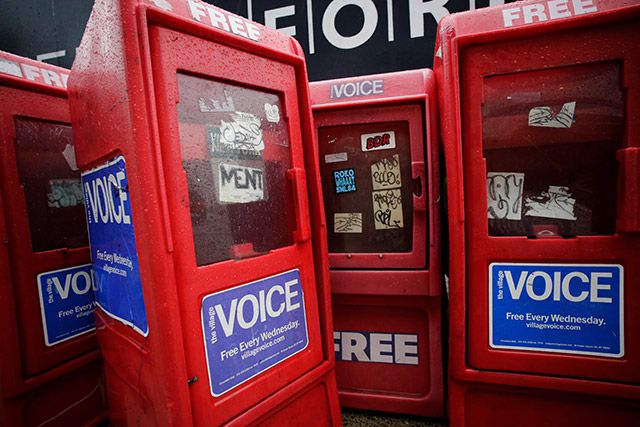Village Voice newspaper boxes on a sidewalk in 2013